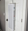Red light therapy device on a interior door.