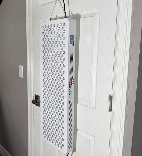 Red light therapy device on a interior door.